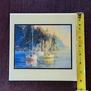 Sailboat mored in a seacoast harbor. wall tile art